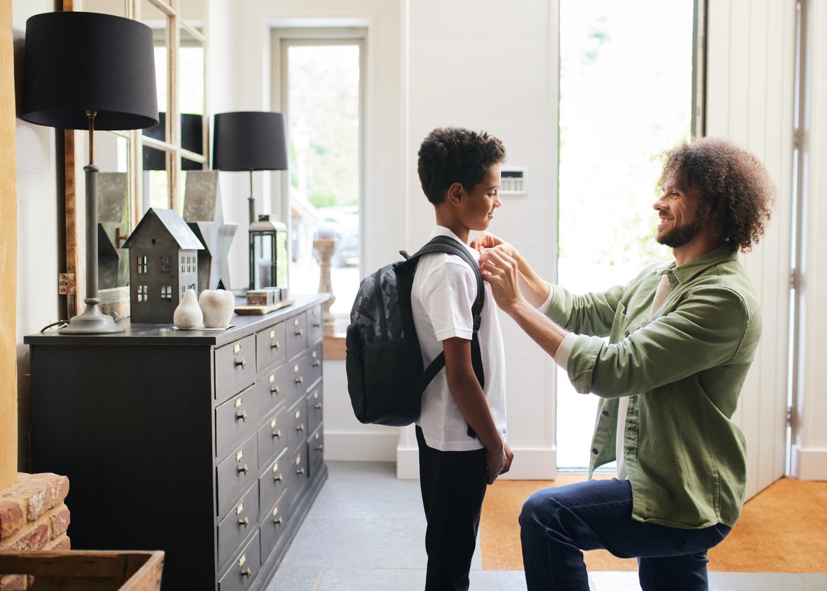 dad and son getting back into routine for school.