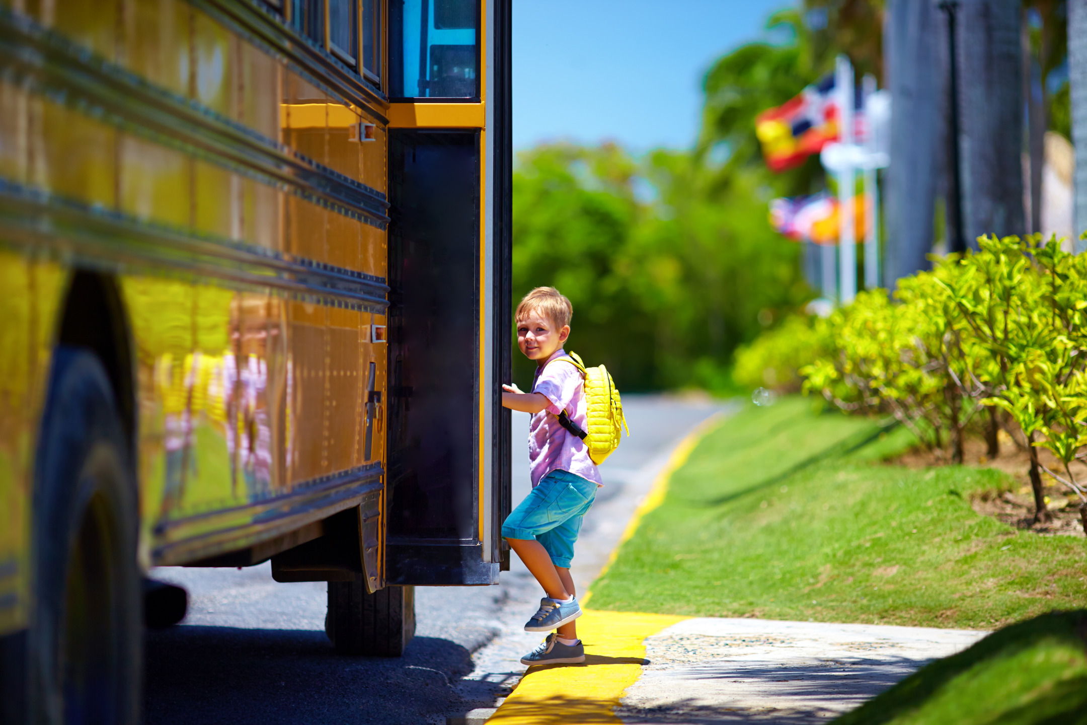 Anxious child getting on school bus