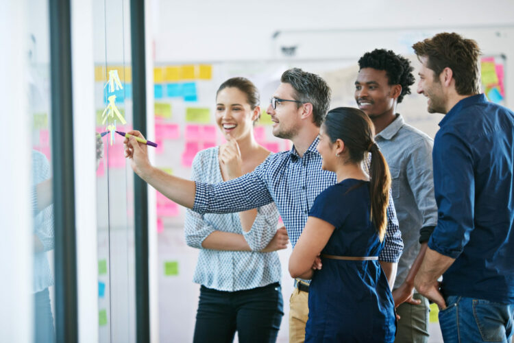 Discussion, glass wall and team of business people in office planning creative strategy for brand management. Meeting, ideas and group of public relations specialists by board for project at startup